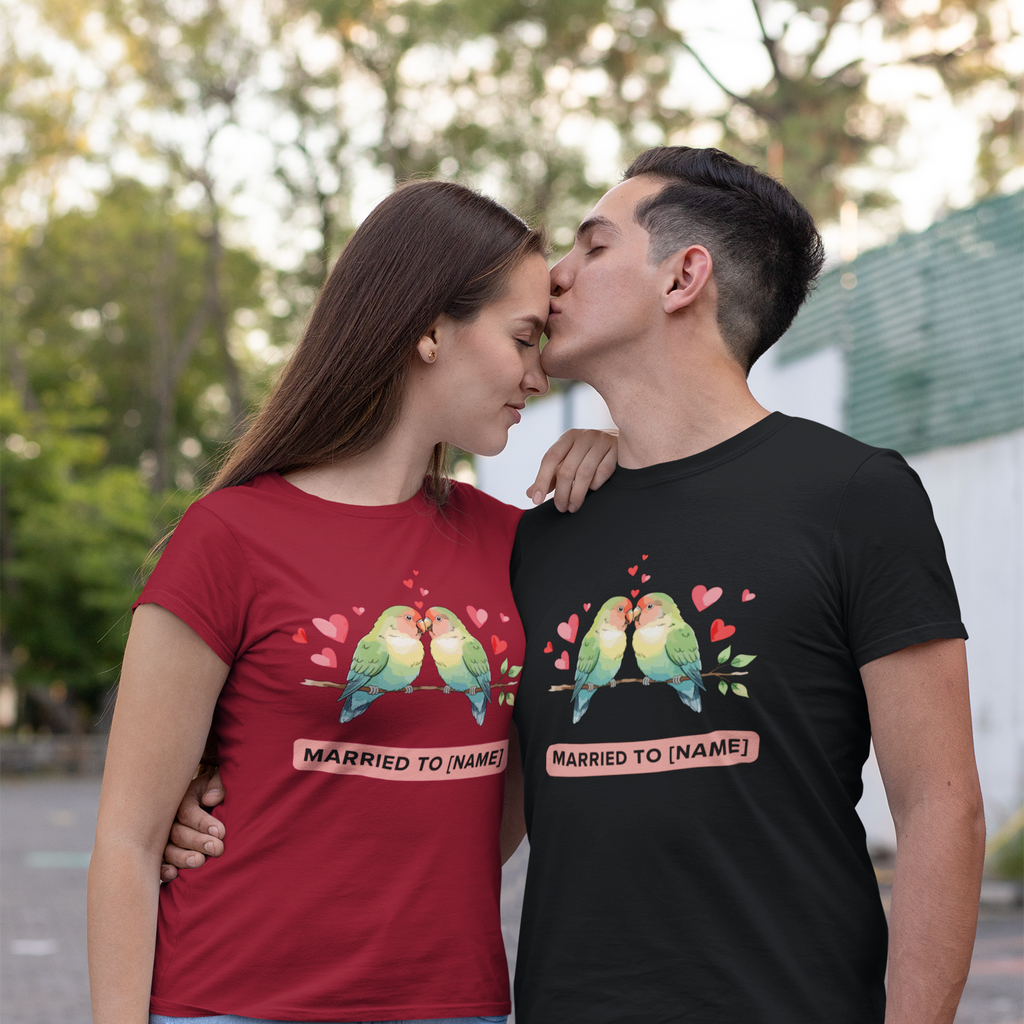 Two people wearing matching t-shirts with a graphic design and text.